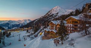 Méribel : un Coucou niche sur les pistes - Le Carlina, un repère pour skieurs à La Plagne 